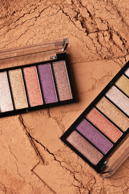 Eyeshadow palette with multiple shades and cosmetic powder