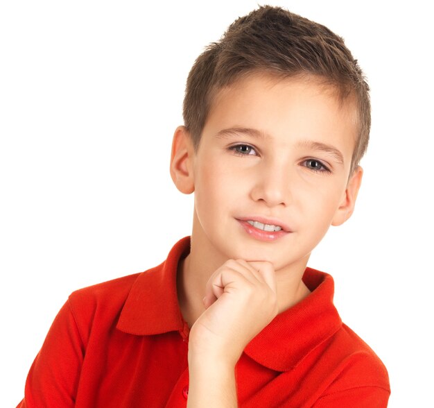 Face of adorable young smiling boy isolated on white