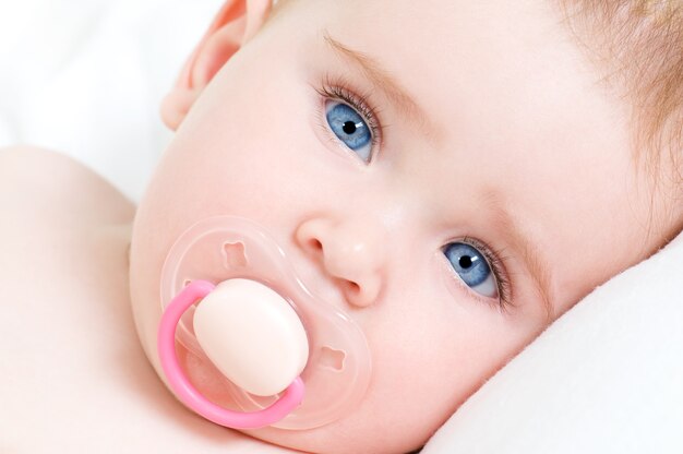 face of a beautiful newborn girl with blue face