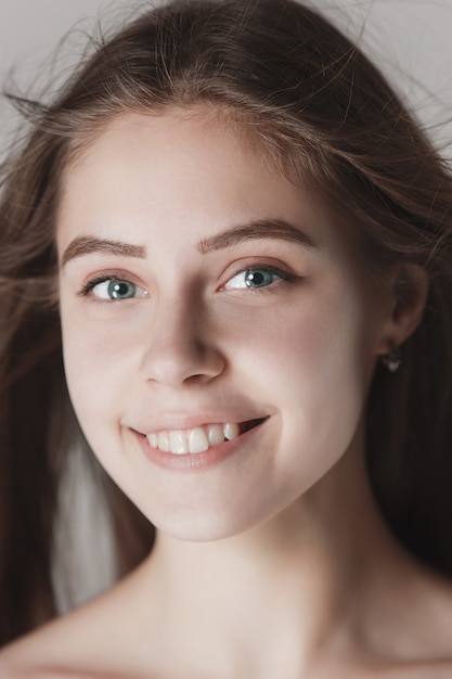 Face of a beautiful young girl with a clean fresh face close up