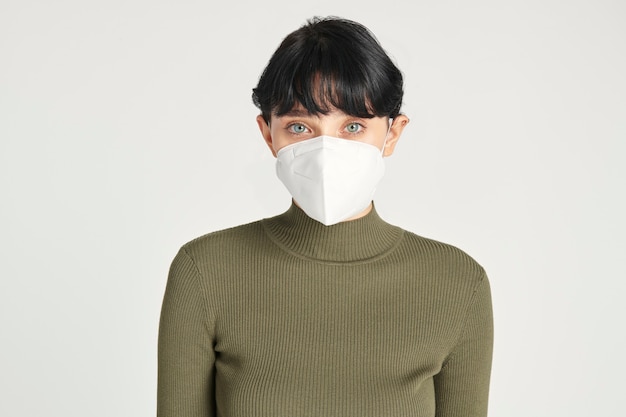 Face mask mockup on a women in a green turtleneck top