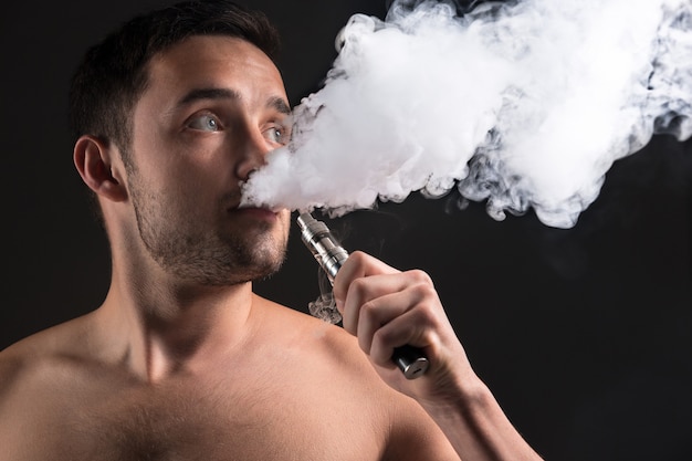 Free photo the face of vaping young man