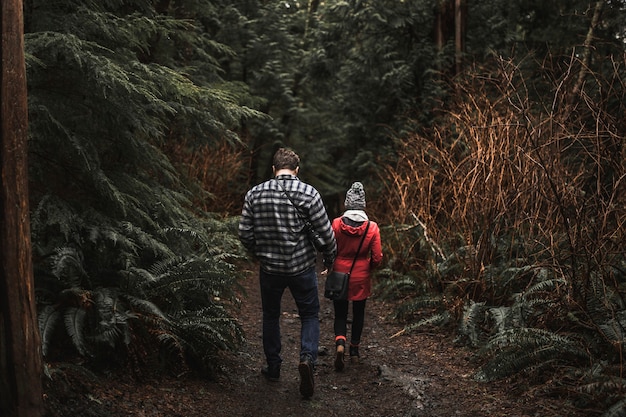 Free photo faceless couple in forest