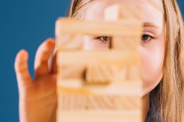 Faceless girl playing jenga