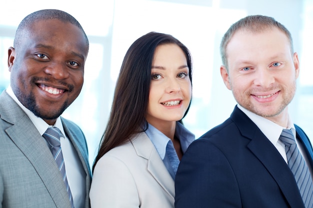 Faces close-up of smiling executives