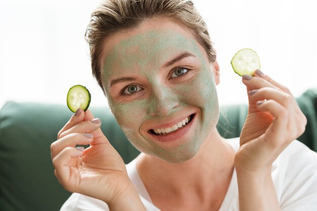 Facial mask and slices of cucumber front view