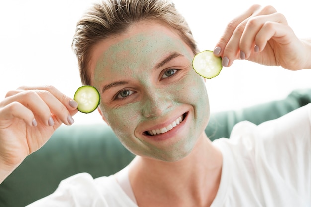 Facial mask and slices of cucumber