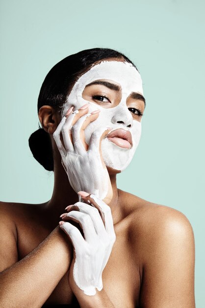 Facial treatment concept womanas portrait with a facial mask