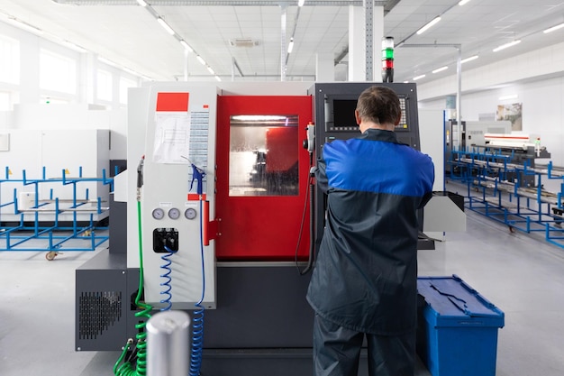 Factory worker engineer of metal processing equipment Photo with depth of field