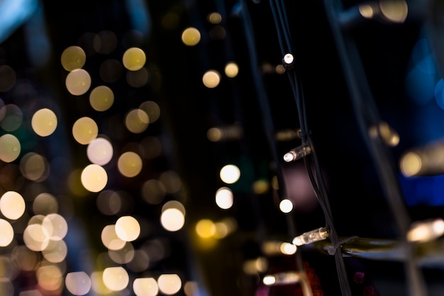 Fairy light against golden bokeh backdrop