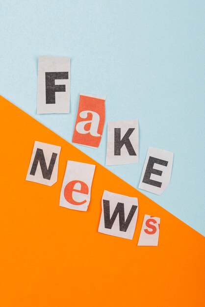 fake news with paper pieces  above view