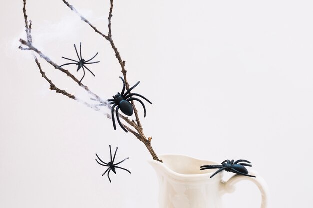 Fake spiders on branch