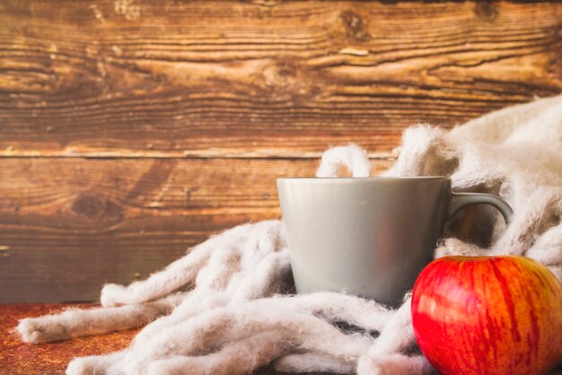 Free photo fall composition with warm wrap and mug