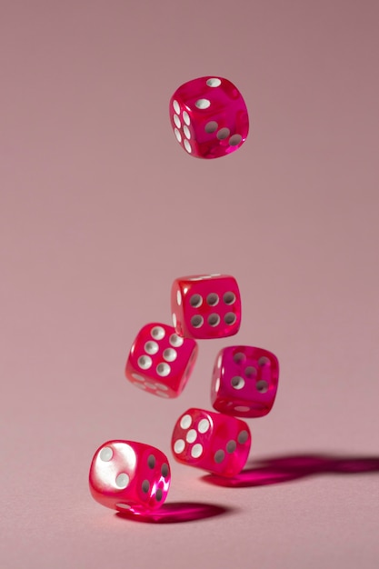 Falling pink dices on pink background