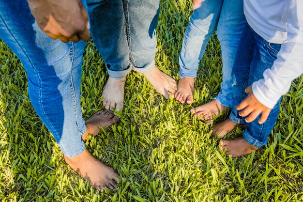 family barefoot in garden