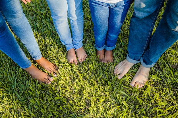Family barefoot on the grass