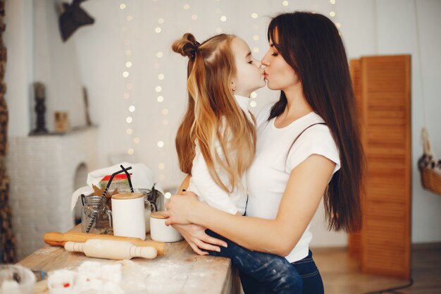 Family cook the dough for cookies