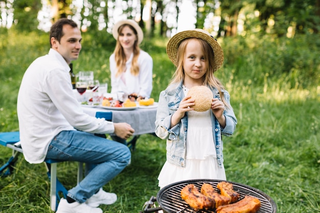 Family doing a barbecue in nature