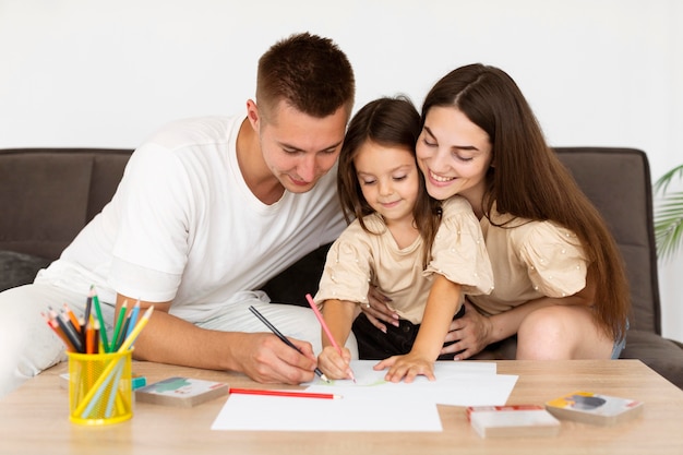 Family drawing together at home