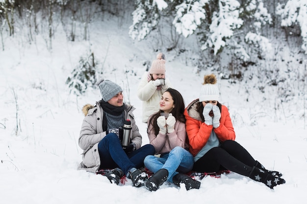 Family enjoying tea in nature