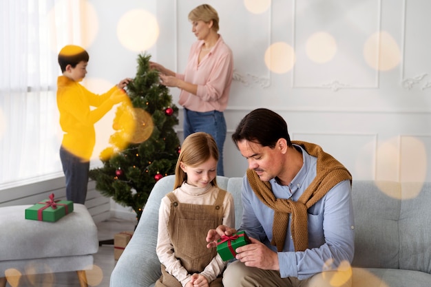 Family of four celebrating new years eve at home together