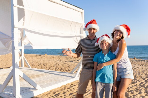 Premium Photo | A family of four, mom dad and two children in santa