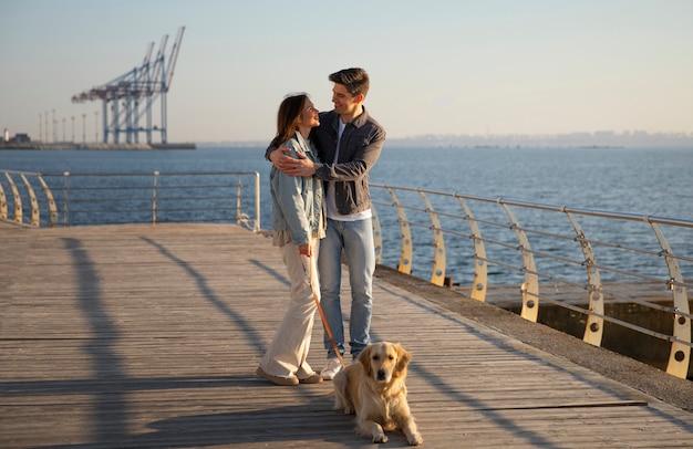 Free photo family hanging out on a jetty