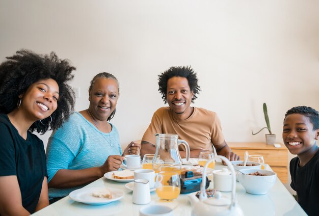 Family having breakfast together at home.