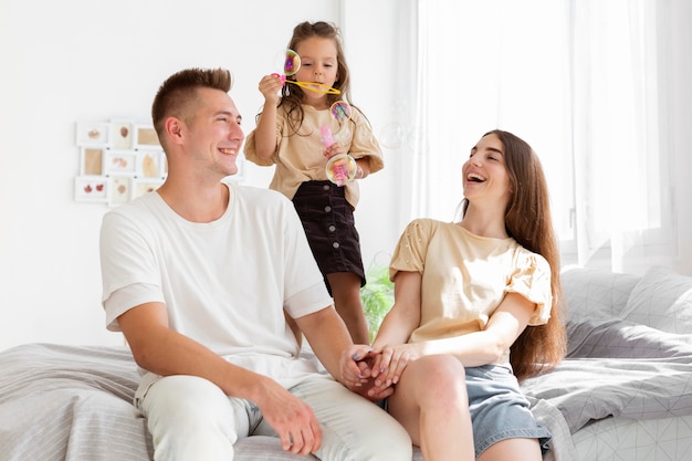 Family having a cute moment together in bed