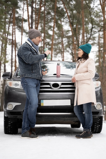 Free photo family having fun during winter roadtrip