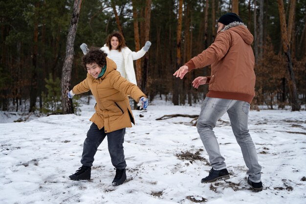 Family having fun outdoors full shot