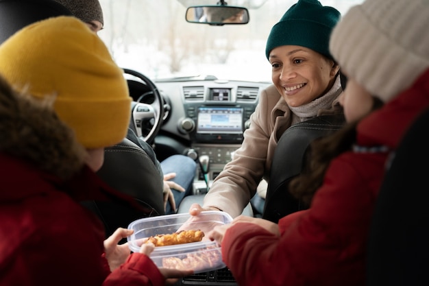 Family having fun during winter roadtrip