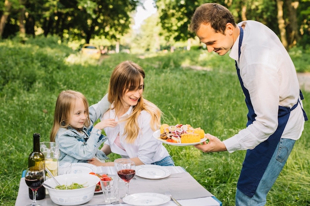 Family having a picnic in nature