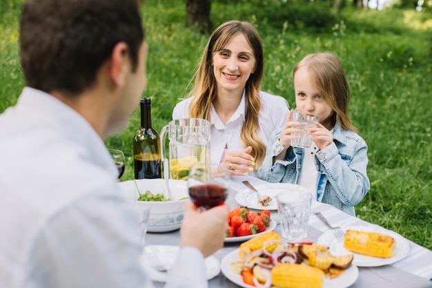 Family having a picnic in nature