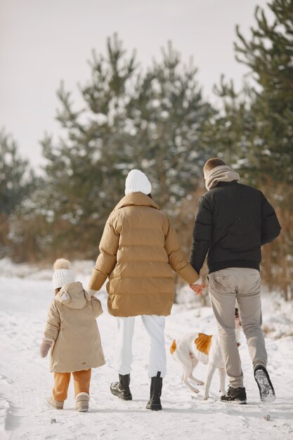 family in knitted winter hats on vacation