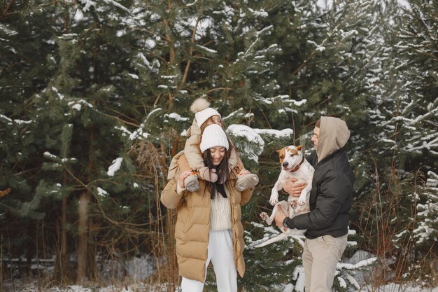 family in knitted winter hats on vacation
