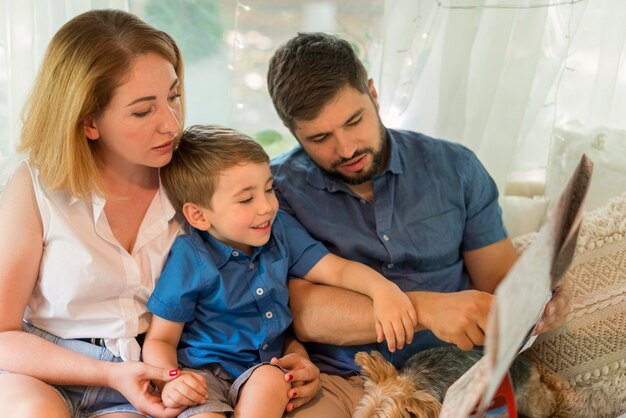 Family looking through a map in a caravan