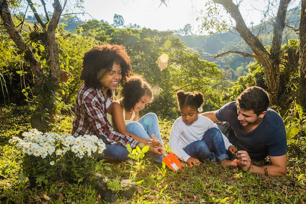 Free photo family lying on a hill