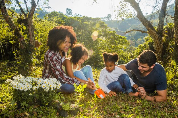 Family lying on a hill