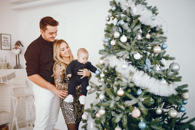 Family near Christmas tree