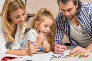 Free photo family painting on the floor