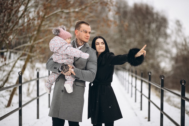 Family in park in winter with baby daughter