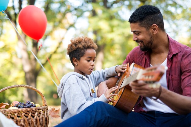 Family playing guitar together