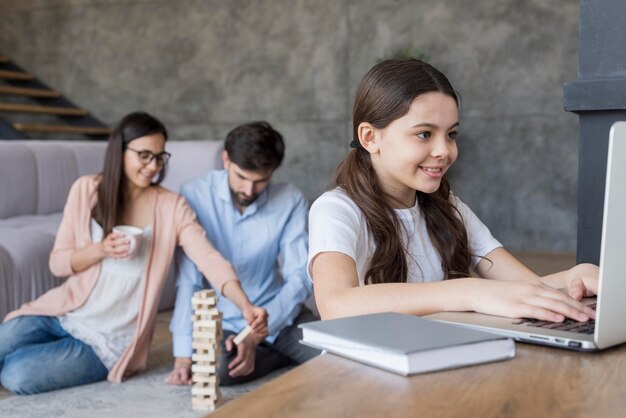 Family playing jenga at home