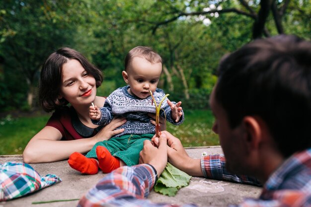 Family playing at table outside