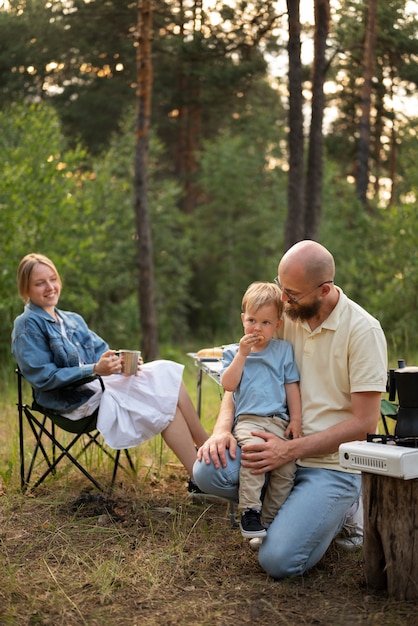 Family preparing dinner while in camping