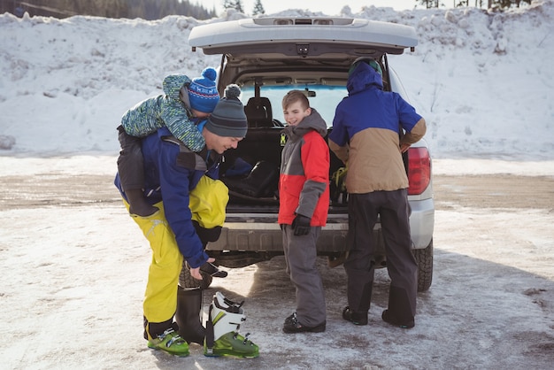 Family preparing for ski