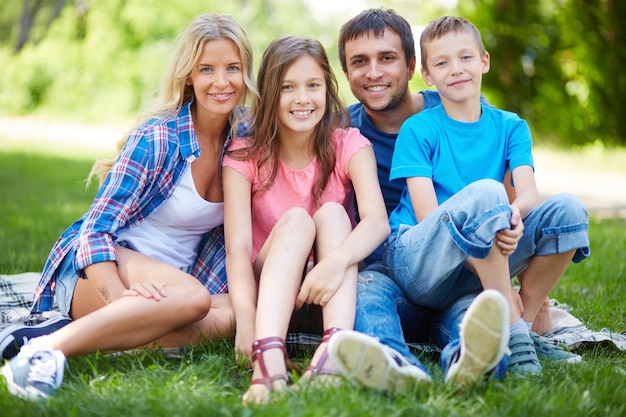 Family resting on the grass