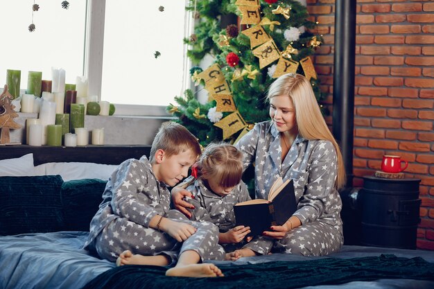 Family sitting on a bed