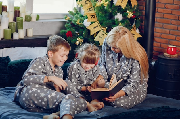 Family sitting on a bed